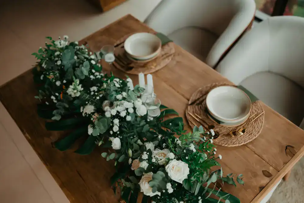 Lush floral table runner at a formal dinner event
