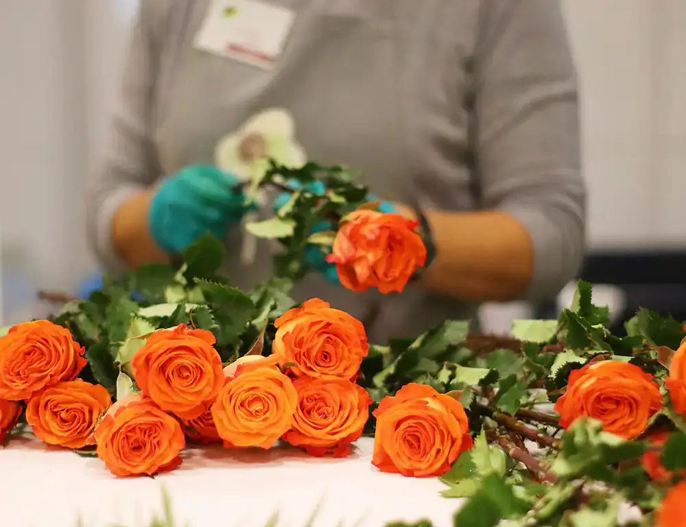 Florist arranging event flowers in the studio